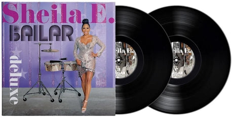 Vinyl records with a cover featuring a woman and musical instruments on a purple background.