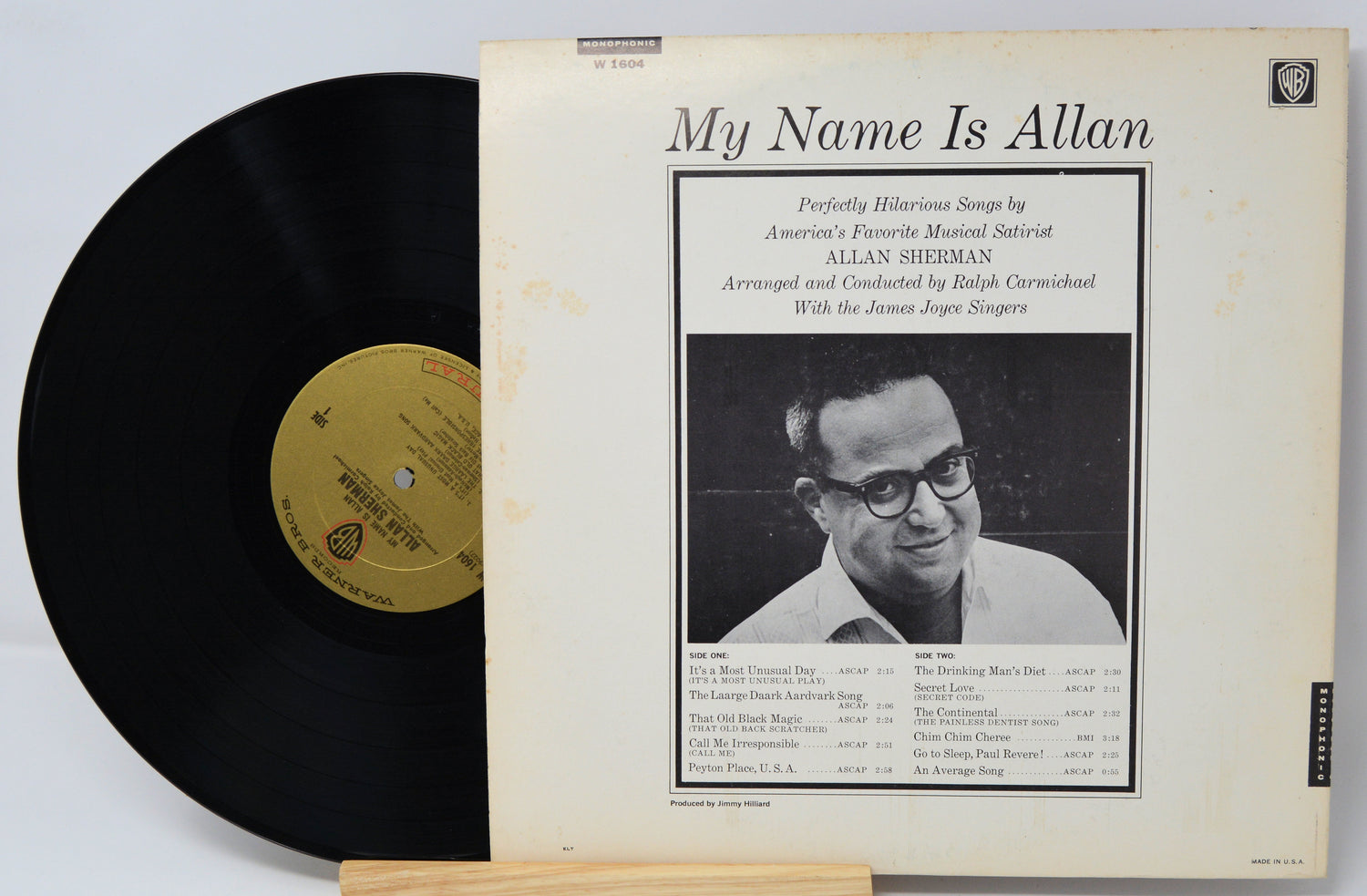 Vinyl record with cover featuring a black and white photo of a man and text.