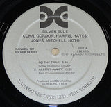 Close-up of Silver Blue Xanadu Records vinyl label with artist credits and track listing