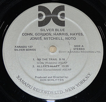 Close-up of Silver Blue Xanadu Records vinyl label with artist credits and track listing