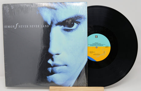 Front cover and vinyl record of Simon F Never Never Land with blue-toned portrait