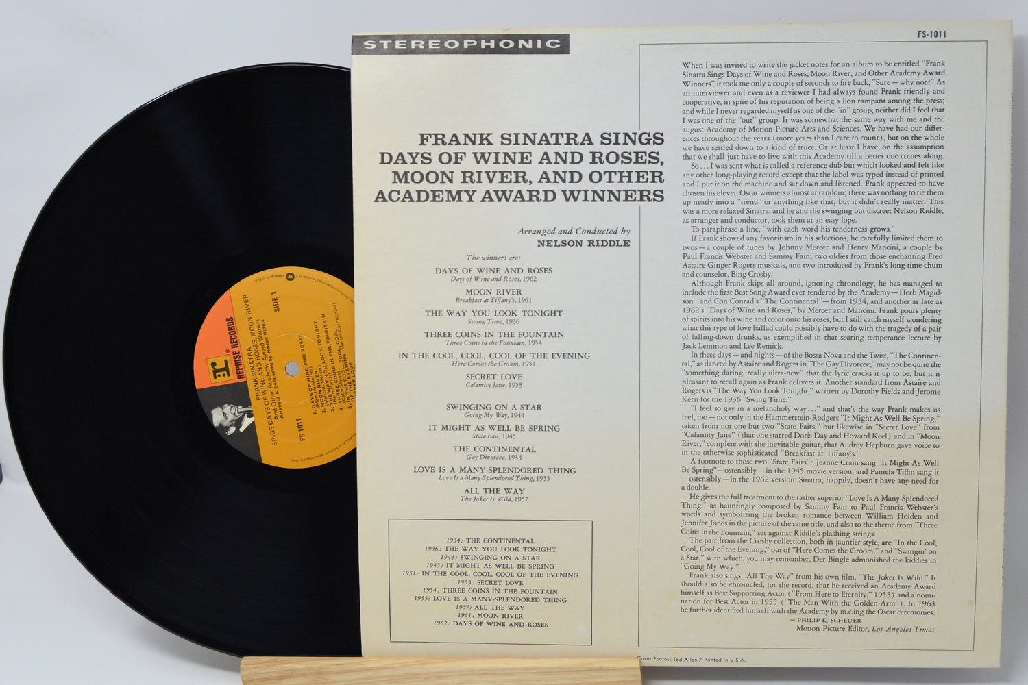 Vinyl record with cover featuring text and a label
