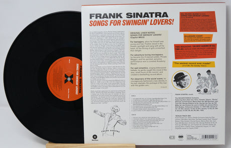 Vinyl record with its cover displaying text and images of Frank Sinatra.