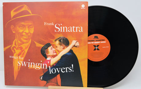 Vinyl record with cover featuring Frank Sinatra and a couple, titled 'Songs for Swingin' Lovers'.