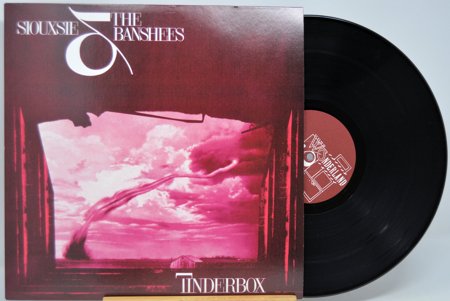 Black Vinyl record with cover featuring a pink sky and clouds, titled 'Tinderbox' by Siouxsie & the Banshees.