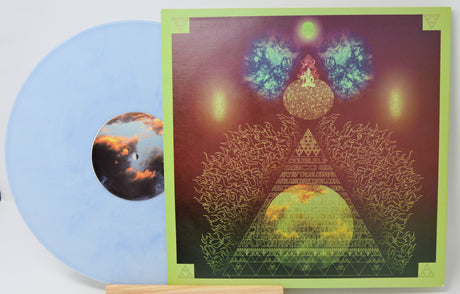 Limited edition sky blue vinyl LP beside vibrant psychedelic album cover art