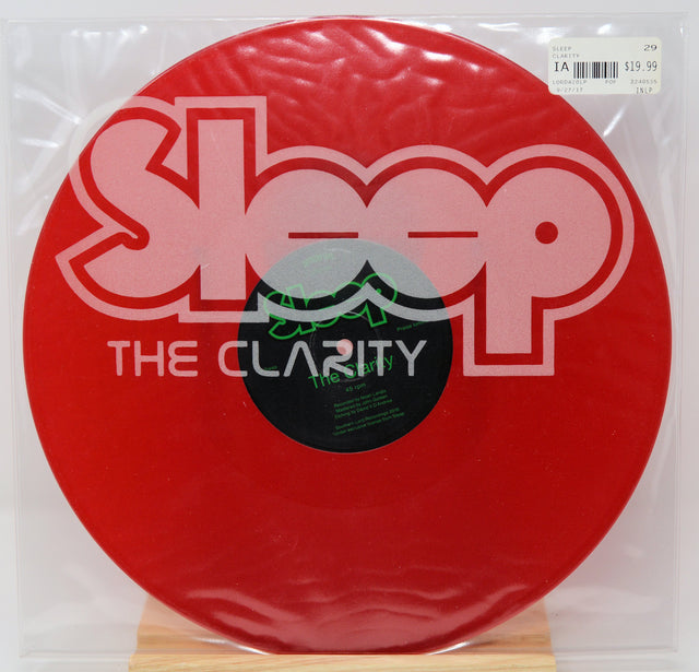 Red vinyl record with 'Sleep' and 'The Clarity' text on a white background