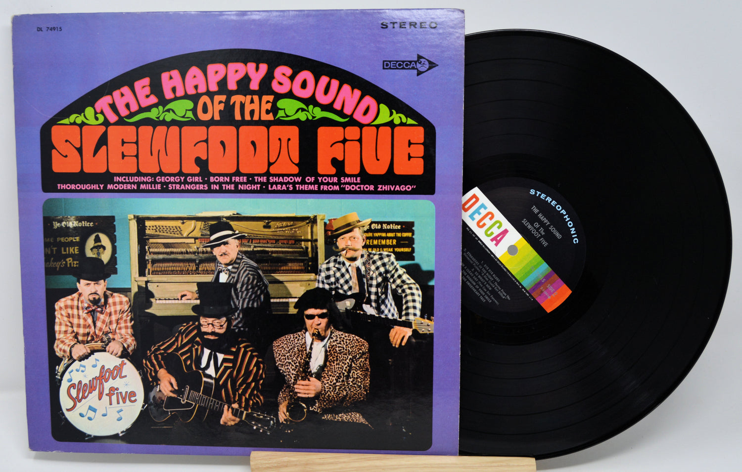 Vinyl record with cover featuring 'The Happy Sound of the Slew Doom Five' on a white background