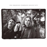 The image shows the cover art for 'Rotten Apples: Greatest Hits' by The Smashing Pumpkins. The band members are pictured from behind, wearing casual clothing, with a sign in the background that reads 'END'.