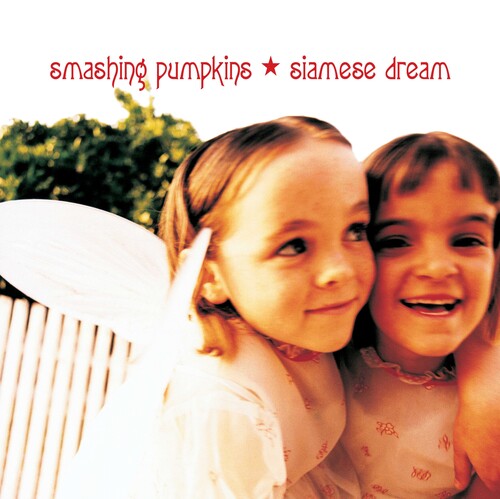 The image features the album cover of 'Siamese Dream' by the Smashing Pumpkins. It showcases two young children, one with a hat on and the other with short hair, smiling brightly at the camera.
