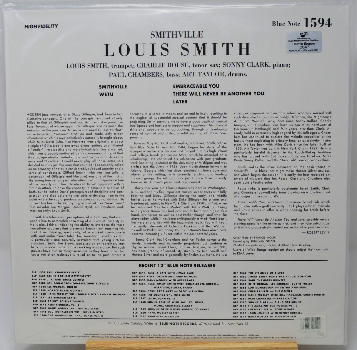 The back cover of a Louis Smith 'Wetu' Blue Note Records LP record, showing detailed track listings, credits, and text on a white background with a small portion of a wooden surface visible at the bottom.