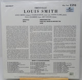 The back cover of a Louis Smith 'Wetu' Blue Note Records LP record, showing detailed track listings, credits, and text on a white background with a small portion of a wooden surface visible at the bottom.