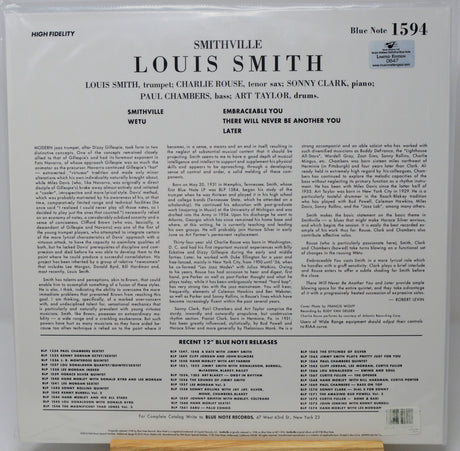 The back cover of a Louis Smith 'Wetu' Blue Note Records LP record, showing detailed track listings, credits, and text on a white background with a small portion of a wooden surface visible at the bottom.
