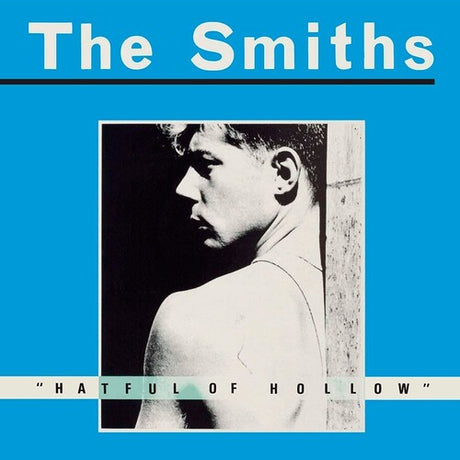 Album cover for The Smiths - Hatful of Hollow featuring a black and white photograph of a man's profile against a blue background.