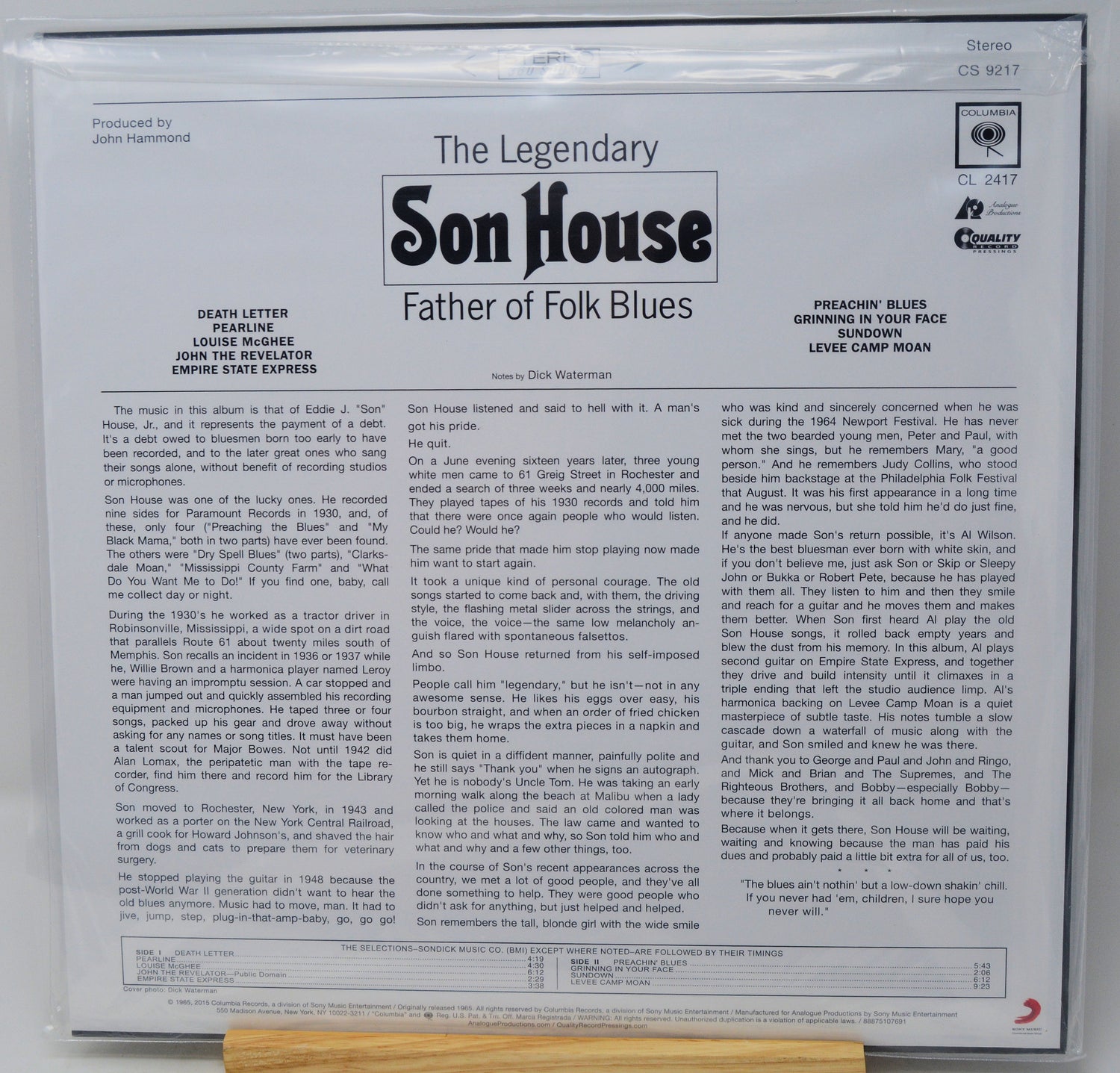 The back cover of a vinyl record sleeve for 'The Legendary Son House: Father of Folk Blues' on Columbia Records, featuring multiple columns of text, artist credits, and track listings on a white background.