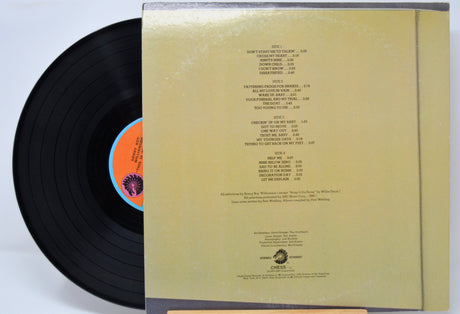 Vinyl record 'Sonny Boy Williamson This Is My Story' with a orange label showing track listings on a white background