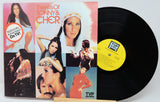 Vinyl record with colorful cover featuring a guitarist and text