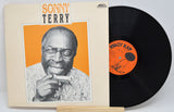 Vinyl record with cover featuring a portrait and 'Sonny Terry' text on a white background