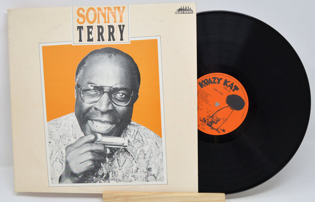 Vinyl record with cover featuring a portrait and 'Sonny Terry' text on a white background