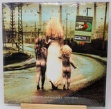 Vinyl record cover with a stylized image of three figures and text 'Soul Asylum' on a white background.