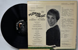 Vinyl record with cover featuring a portrait of a woman and text about 'The Sound of Music'.