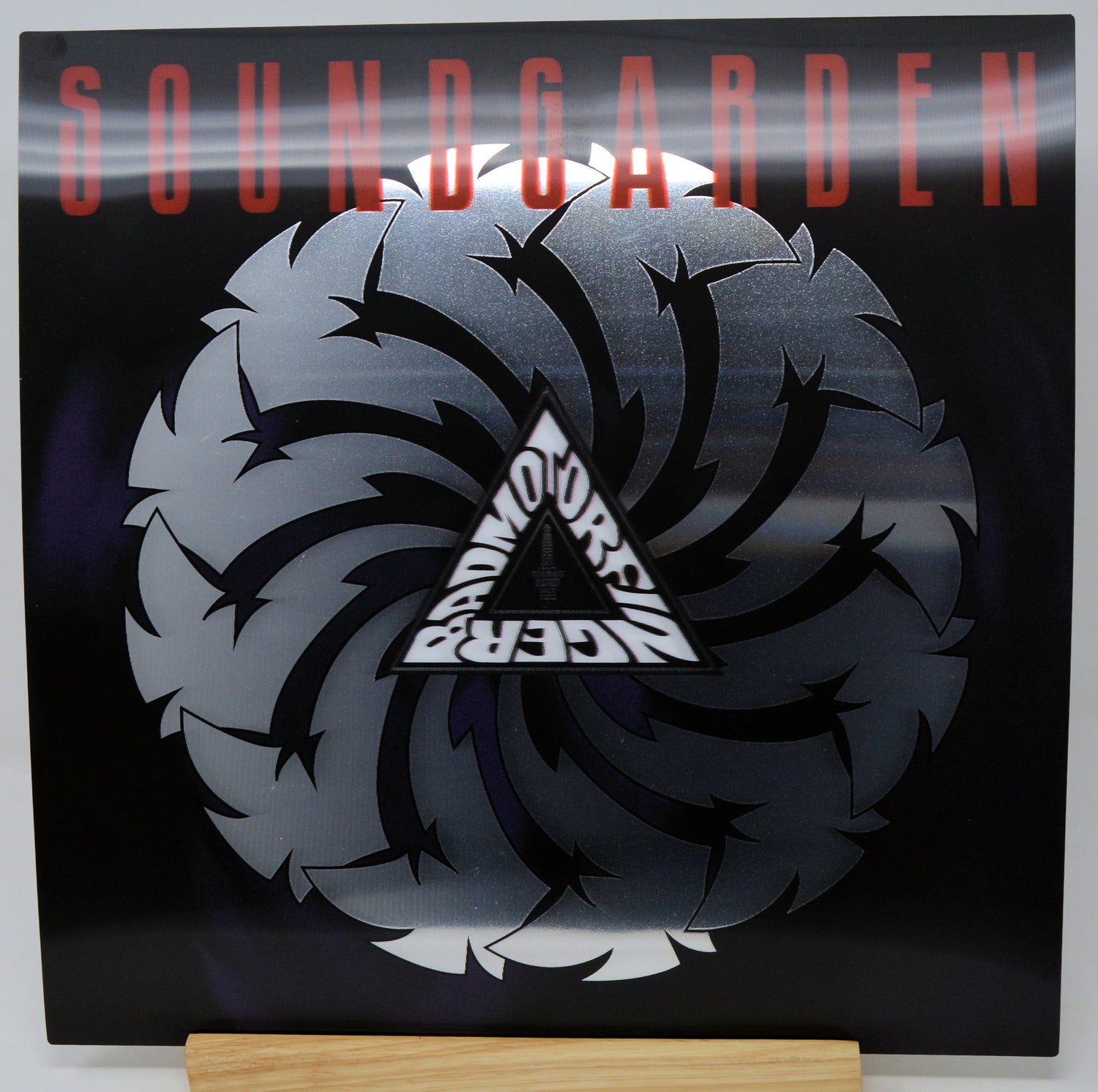 Soundgarden 'My Dark Eternal Side' vinyl record sleeve displayed on a wooden stand against a white background.