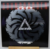 Soundgarden 'My Dark Eternal Side' vinyl record sleeve displayed on a wooden stand against a white background.
