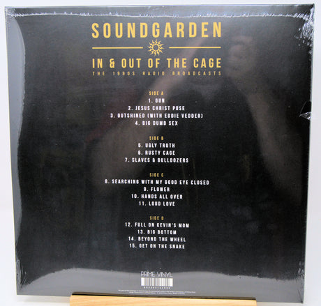 The back cover of a Soundgarden vinyl record, sealed in plastic shrink wrap, displayed on a wooden stand against a white background.