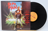 Used vinyl record of 'Repo Man' soundtrack with album cover featuring a man in a tank top and jeans, standing with his hand on a car, against a neon-lit background. The record label is visible with the text 'SAN ANTONIO RECORDS SAR 39019'.