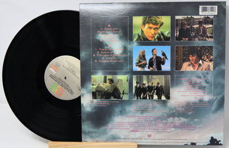 Vinyl record with black cover displaying text on a white background