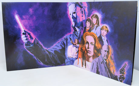 Greeting card with a horror movie-themed illustration of characters and a glowing object.