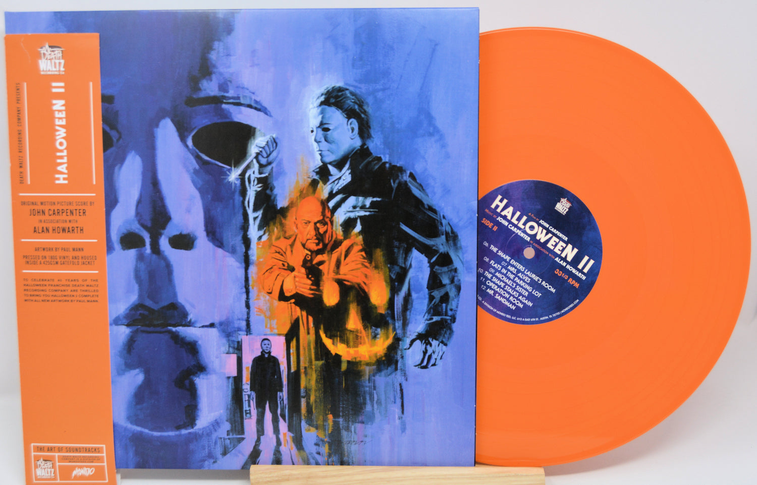 Vinyl record with orange sleeve featuring a character from 'Halloween II' on a white background