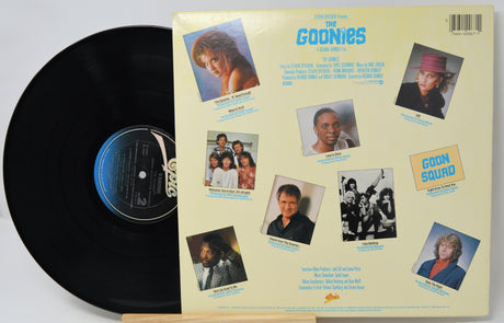 Vinyl record and cover featuring images of a group with text and logos