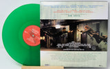 Green vinyl record with a movie poster on a white background