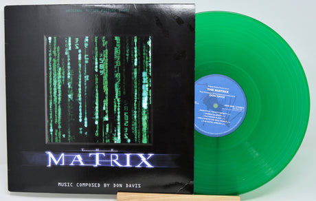 Vinyl record with 'The Matrix' cover featuring green text and a green disc.