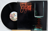 Vinyl record with cover featuring 'The Jukes' on a white background