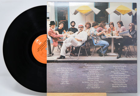 'Southside Johnny Hearts Of Stone' Vinyl record with a cover featuring a group of people at an outdoor cafe.