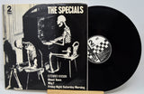 Vinyl record with cover featuring skeletons and 'The Specials' branding