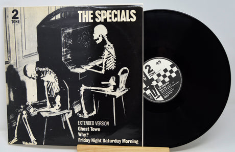 Vinyl record with cover featuring skeletons and 'The Specials' branding