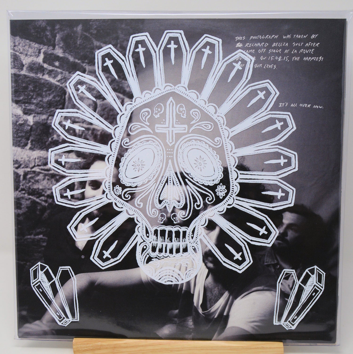 Vinyl record cover with a skull and crossbones design on a black background