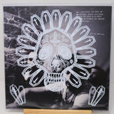 Vinyl record cover with a skull and crossbones design on a black background