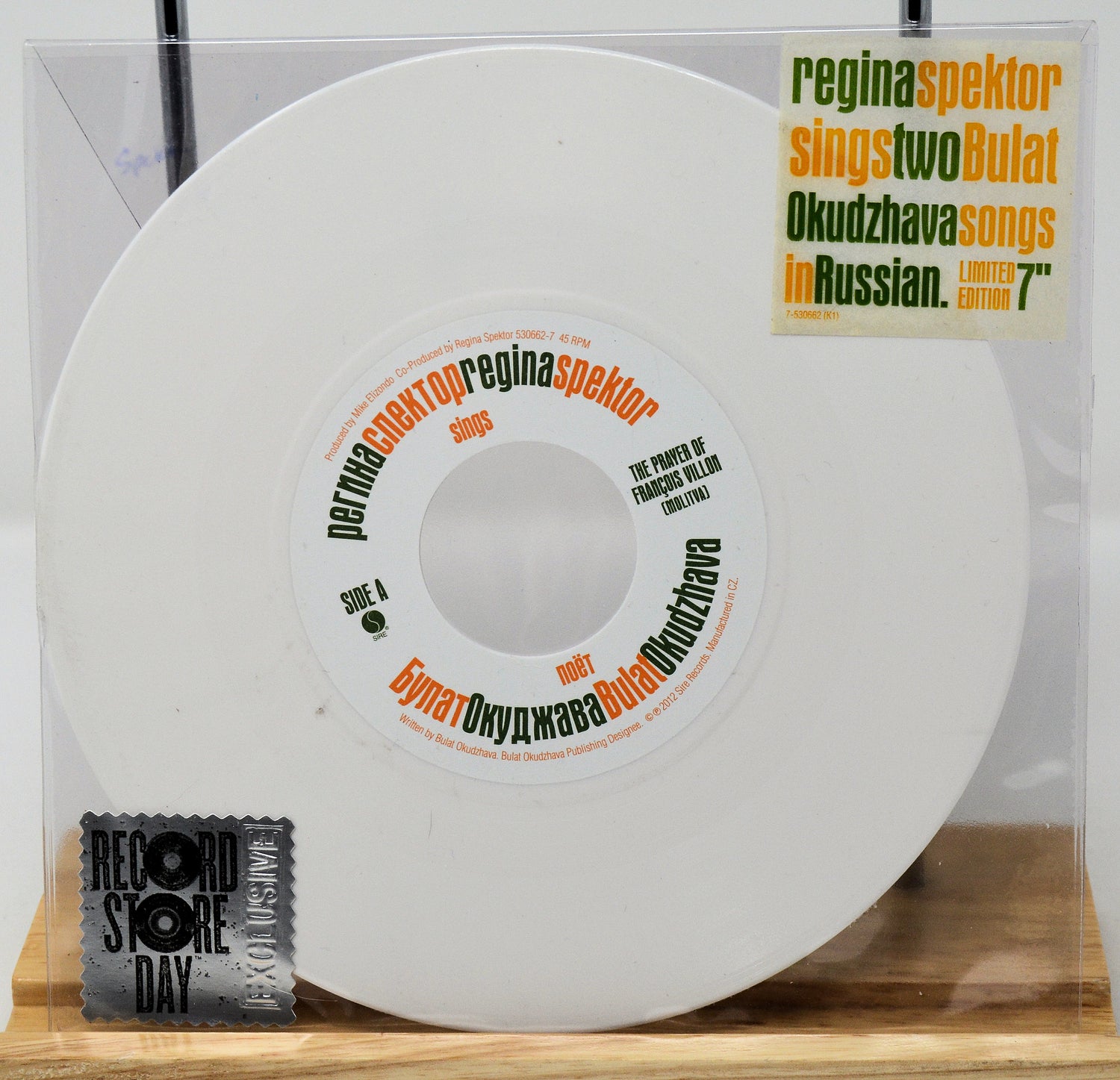 Vinyl record with text on a clear sleeve, featuring Regina Spektor and Two Bulat.