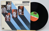 Vinyl record with cover featuring images of a group and ZL Records label.