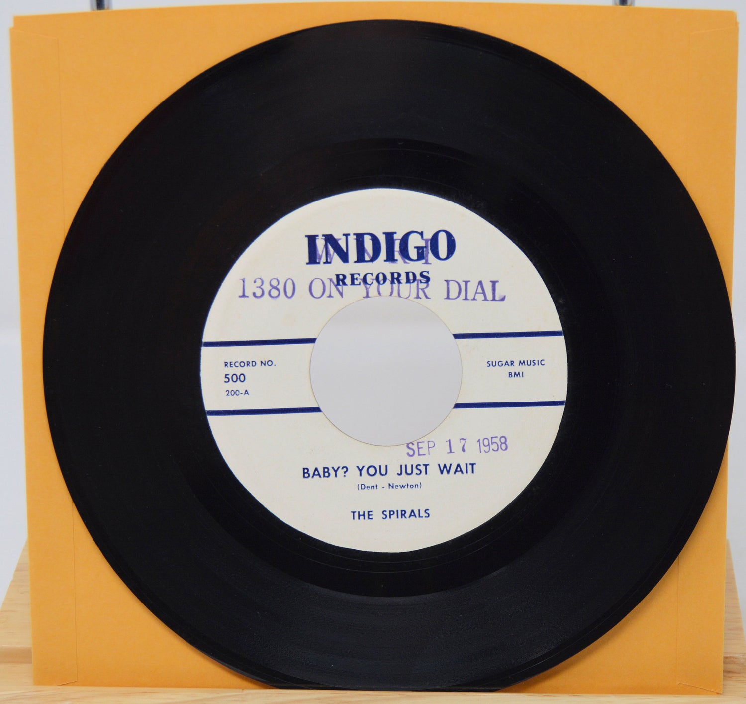 Vinyl record with 'Indigo Records' label on a yellow background