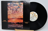 Vinyl record with cover featuring a sunset over water and 'Split Enz' branding.