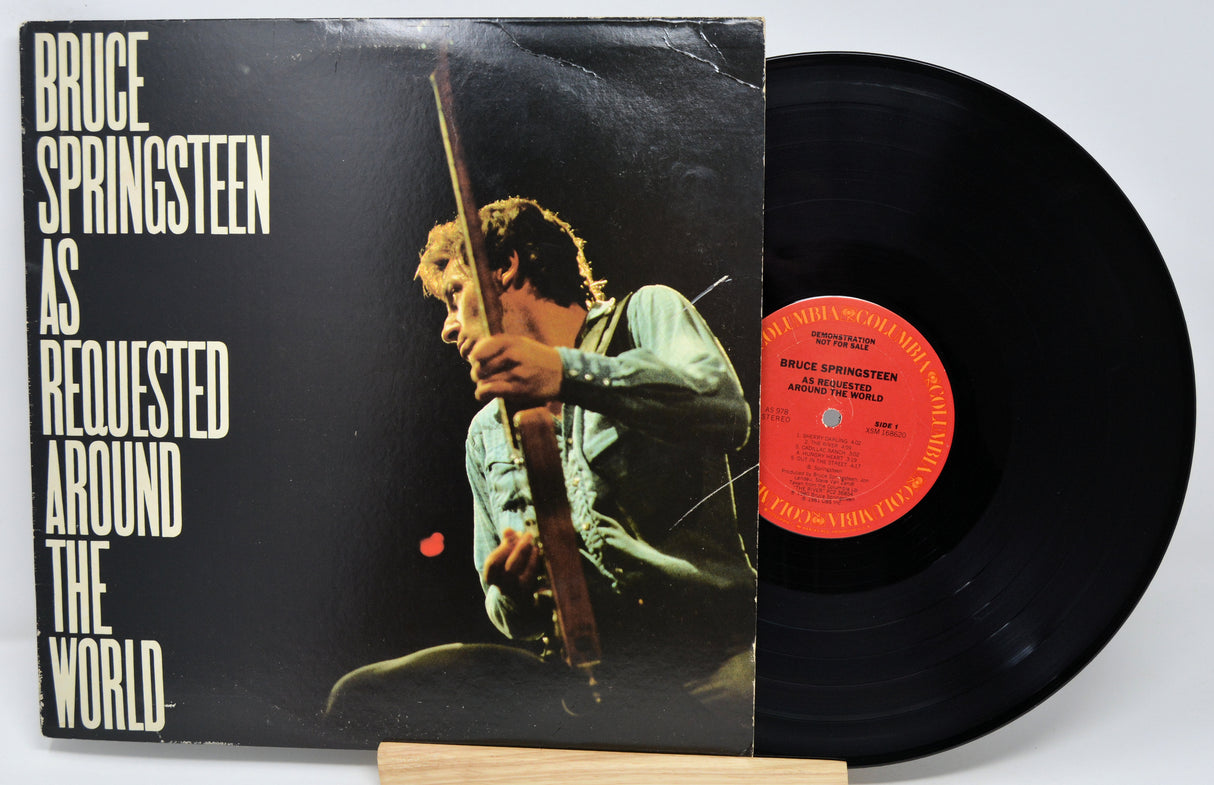 Vinyl record with cover featuring Bruce Springsteen and text 'As Requested Around the World'.