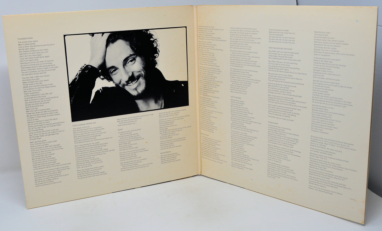 Album cover with a black and white photo of a person on a beige background