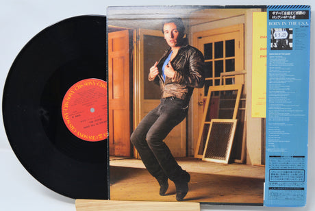 Vinyl record with cover featuring a person in a room.