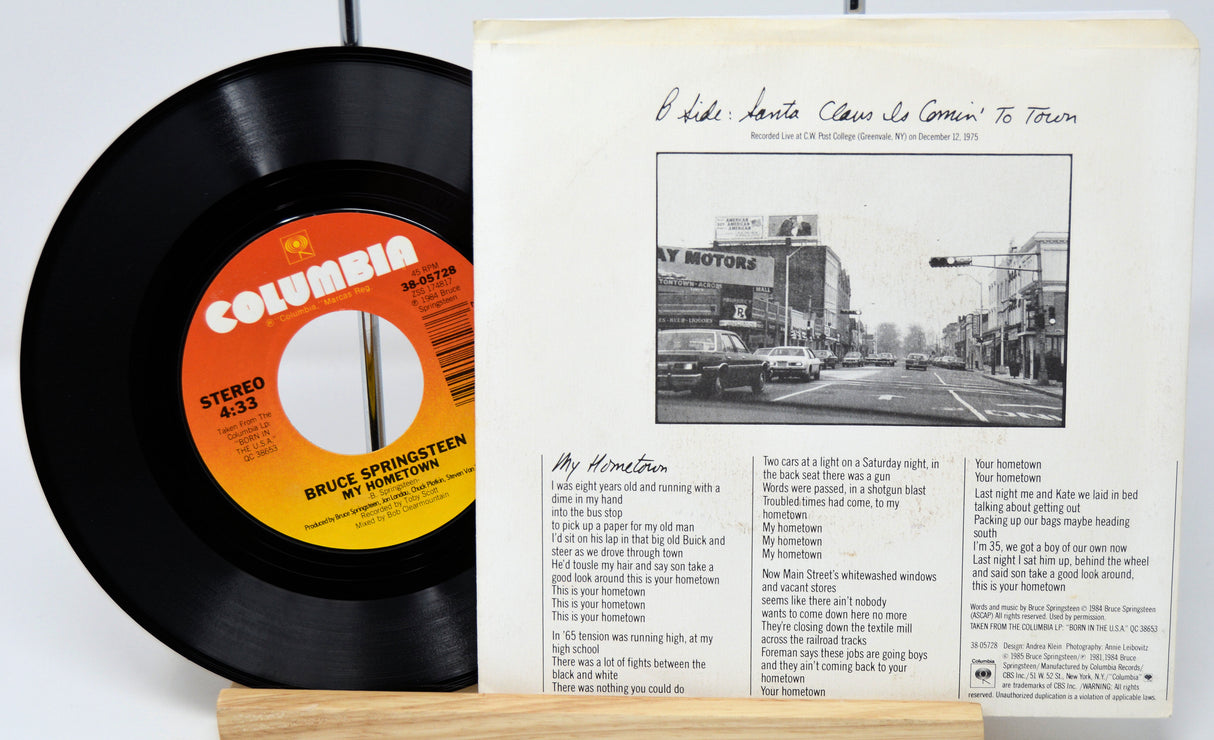 Vinyl record and cover with 'Bruce Springsteen' on a white background