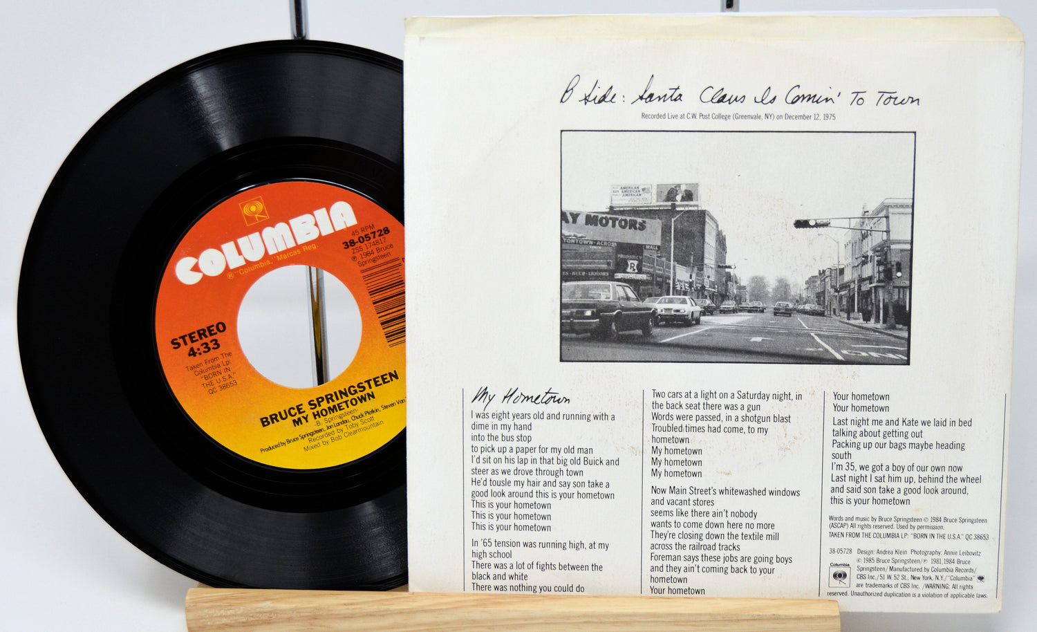 Vinyl record and cover with 'Bruce Springsteen' on a white background